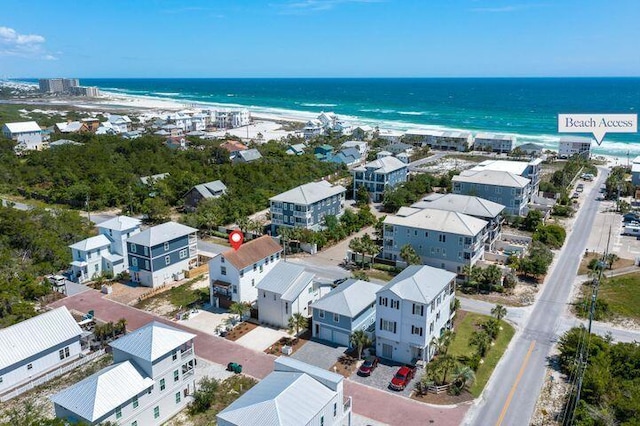 bird's eye view featuring a view of the beach and a water view