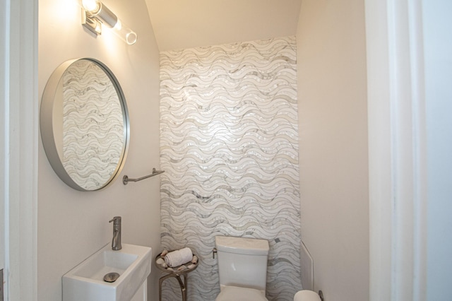 bathroom with sink and toilet