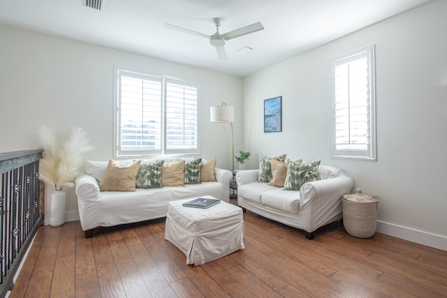 living room with ceiling fan, hardwood / wood-style floors, and a healthy amount of sunlight