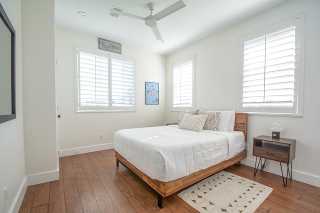 bedroom featuring wood-type flooring and ceiling fan