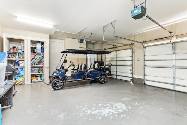 garage featuring a garage door opener