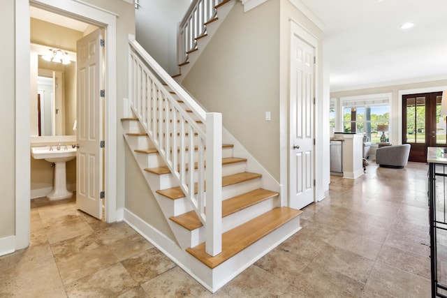 stairway featuring sink