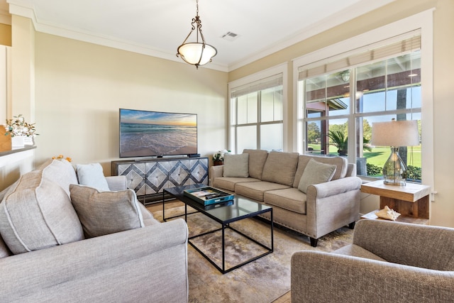 living room featuring crown molding and a wealth of natural light