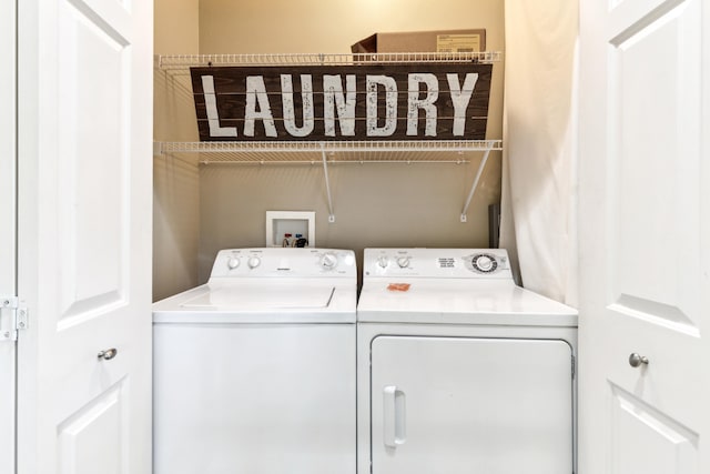 laundry area featuring washing machine and dryer