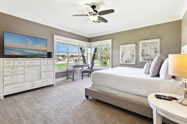 bedroom featuring ceiling fan, light colored carpet, and crown molding