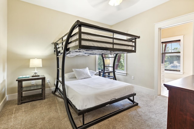 bedroom with light carpet and ceiling fan