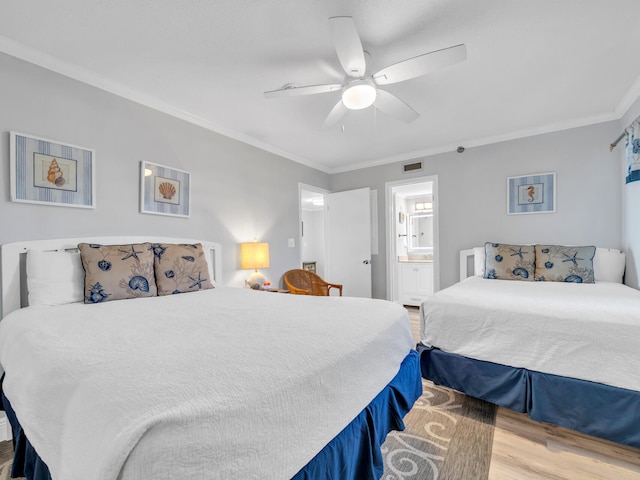 bedroom with light wood-type flooring, crown molding, connected bathroom, and ceiling fan