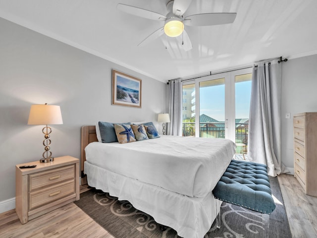 bedroom featuring light wood-type flooring, ceiling fan, access to outside, and crown molding