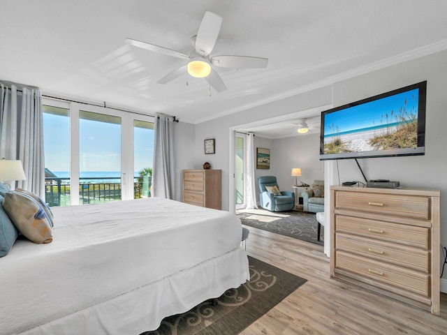 bedroom featuring ornamental molding, light wood-type flooring, ceiling fan, and access to exterior