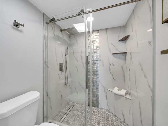 bathroom with toilet and an enclosed shower