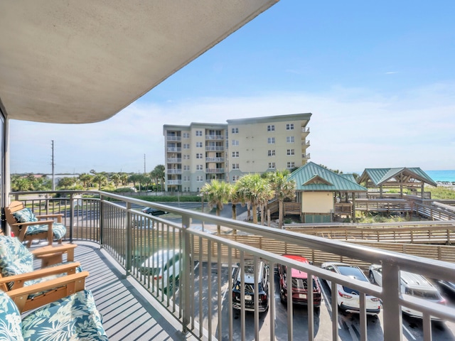 balcony featuring a water view