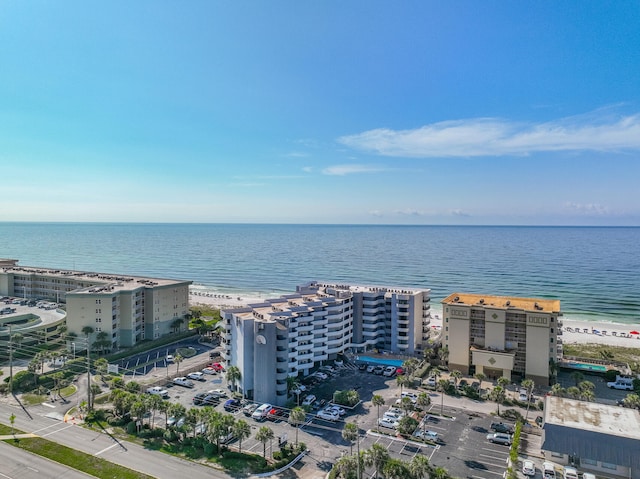 drone / aerial view with a beach view and a water view