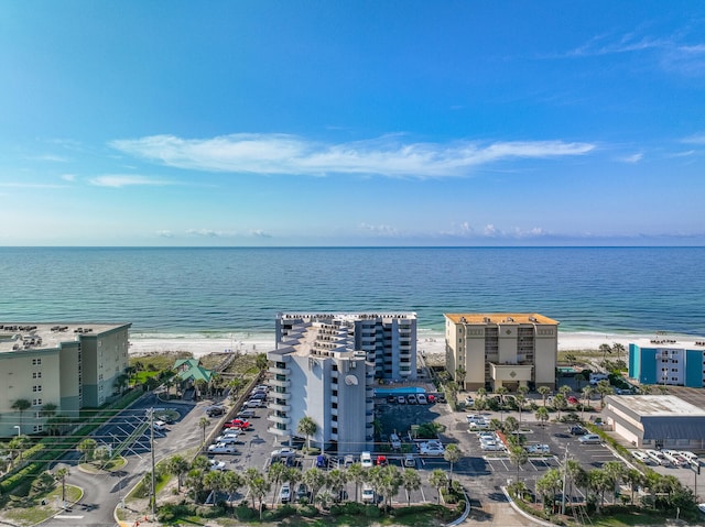 bird's eye view featuring a view of the beach and a water view