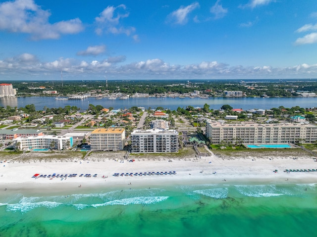 bird's eye view with a water view and a beach view