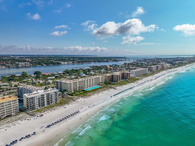 drone / aerial view with a beach view and a water view