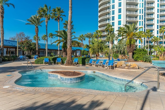 view of swimming pool featuring a patio area