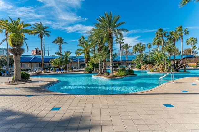 view of swimming pool with a patio