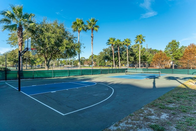 view of basketball court featuring tennis court