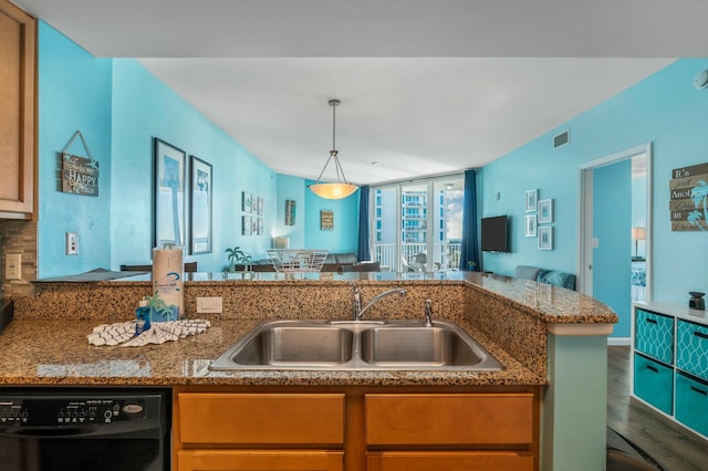 kitchen with kitchen peninsula, dark hardwood / wood-style flooring, sink, decorative light fixtures, and dishwasher