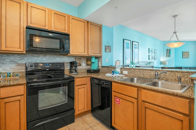 kitchen with tasteful backsplash, sink, light tile patterned floors, and black appliances