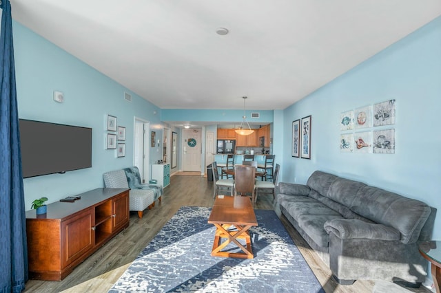 living room with dark hardwood / wood-style flooring