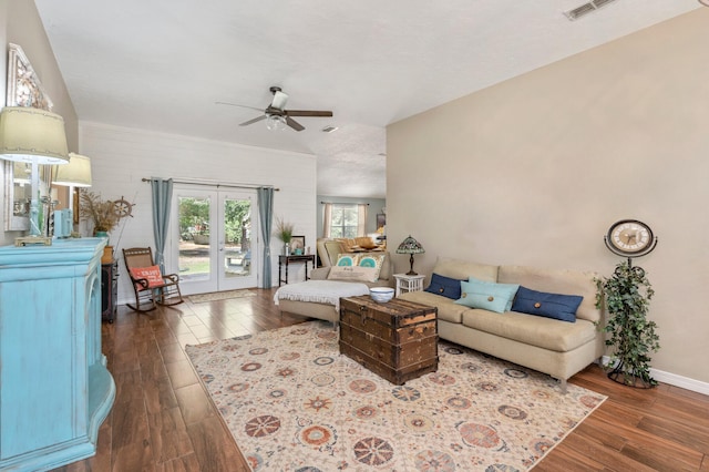 living room featuring french doors, dark hardwood / wood-style floors, and ceiling fan