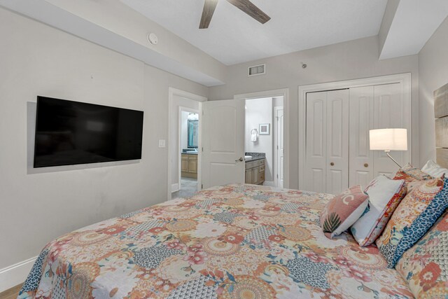 1150 Santa Rosa Blvd Unit 110, Fort Walton Beach, FL 32548 - bedroom with connected bathroom, ceiling fan, and a closet