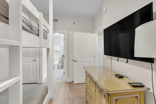 1150 Santa Rosa Blvd Unit 110, Fort Walton Beach, FL 32548 - bathroom featuring hardwood / wood-style floors, vanity, and toilet