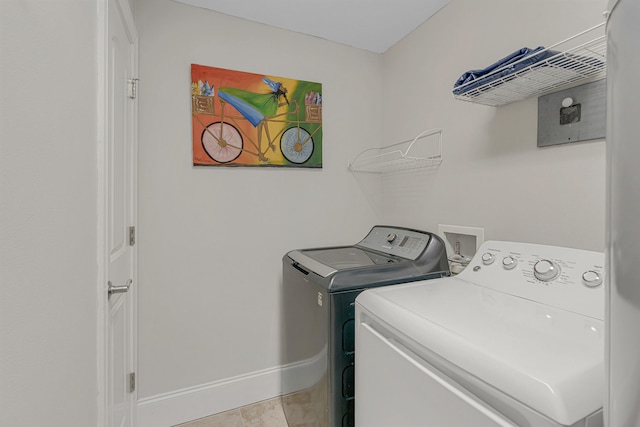 1150 Santa Rosa Blvd Unit 110, Fort Walton Beach, FL 32548 - laundry area featuring independent washer and dryer and light tile patterned floors