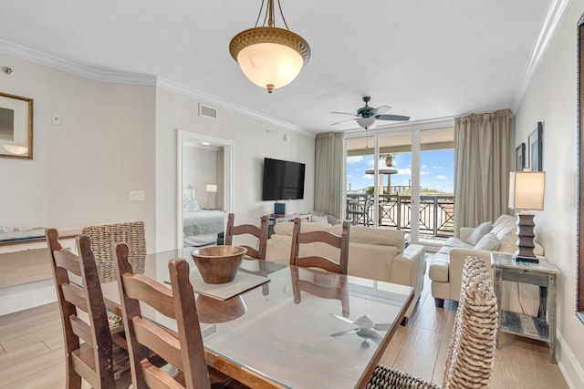 1150 Santa Rosa Blvd Unit 110, Fort Walton Beach, FL 32548 - dining space featuring light wood-type flooring, ornamental molding, and ceiling fan