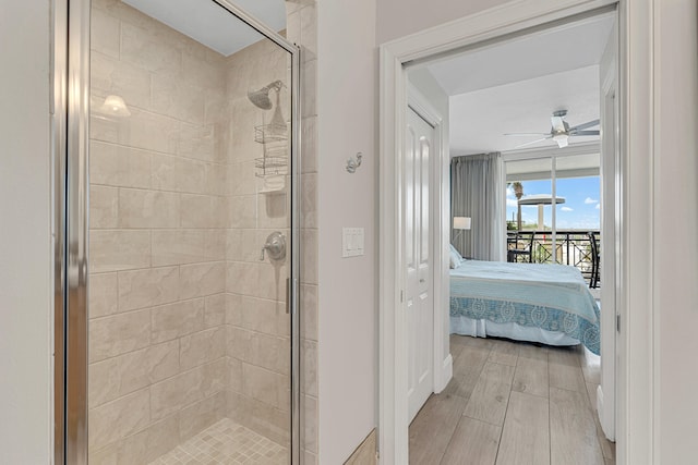 1150 Santa Rosa Blvd Unit 110, Fort Walton Beach, FL 32548 - bathroom with hardwood / wood-style flooring, ceiling fan, and a shower with shower door