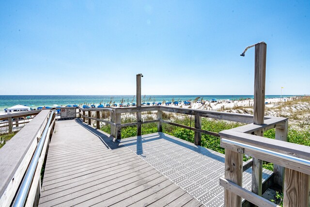 1150 Santa Rosa Blvd Unit 110, Fort Walton Beach, FL 32548 - deck featuring a water view and a view of the beach