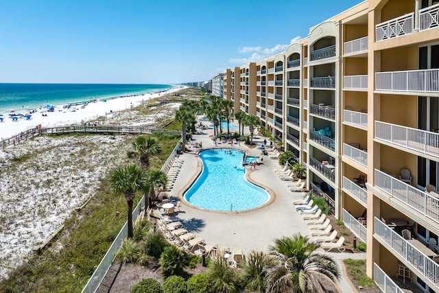 1150 Santa Rosa Blvd Unit 110, Fort Walton Beach, FL 32548 - view of pool featuring a view of the beach, a water view, and a patio area
