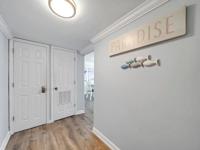 corridor featuring light hardwood / wood-style floors