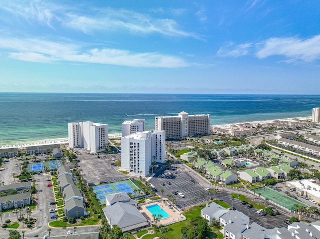 birds eye view of property featuring a water view and a beach view