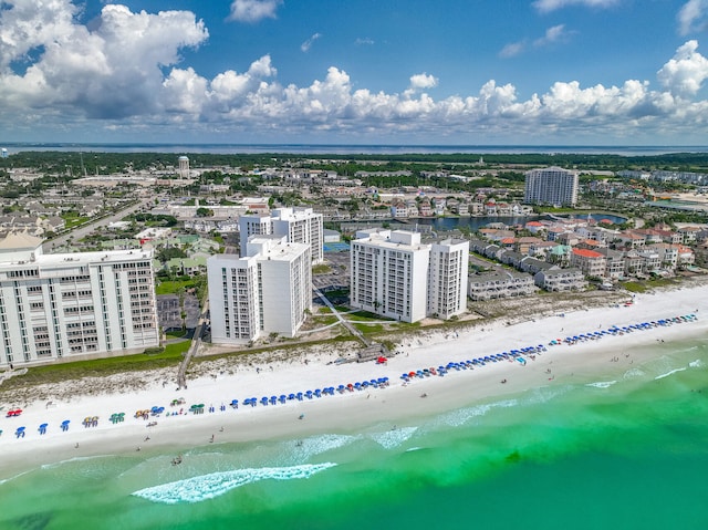 drone / aerial view featuring a view of the beach and a water view