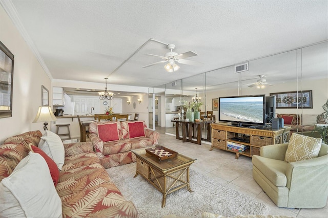 living room featuring crown molding, light tile patterned floors, visible vents, a textured ceiling, and ceiling fan with notable chandelier