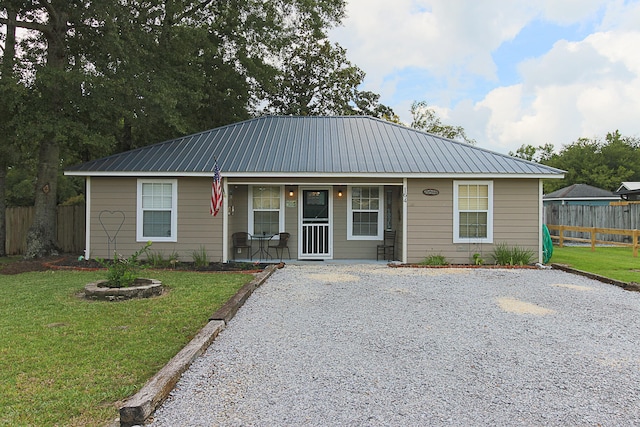 view of front of home with a front yard and a porch