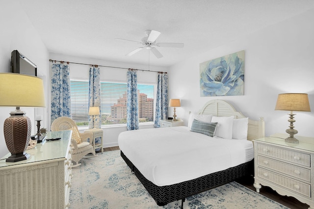 bedroom featuring ceiling fan and hardwood / wood-style floors