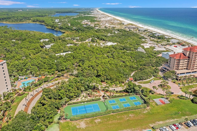 bird's eye view with a water view and a beach view