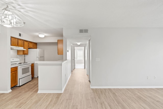 kitchen with decorative light fixtures, white electric range, light hardwood / wood-style flooring, and a notable chandelier