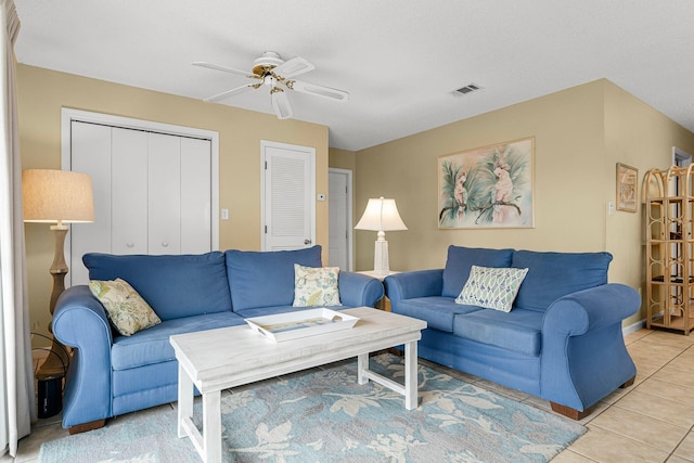 living room with light tile patterned floors and ceiling fan