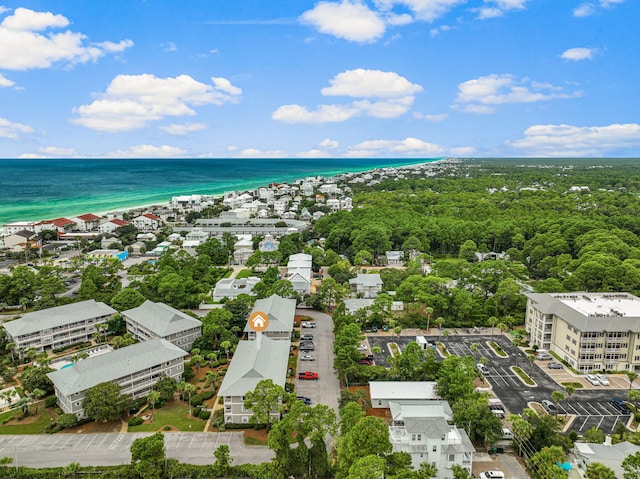 birds eye view of property featuring a water view and a view of the beach