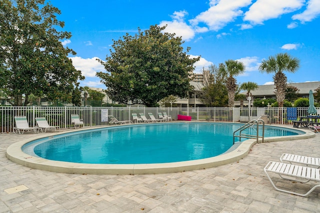 view of pool featuring a patio