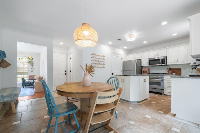 dining room with ornamental molding