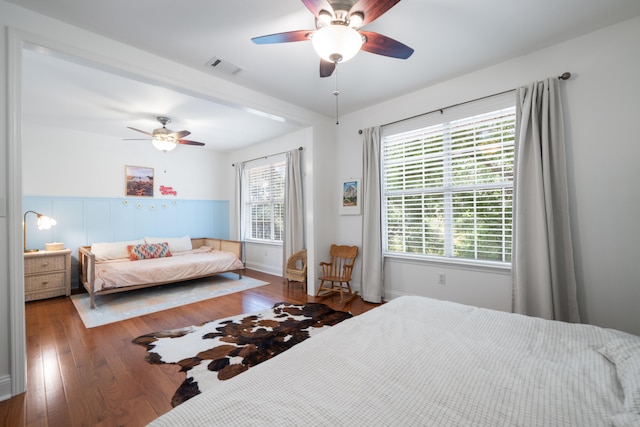 bedroom featuring dark hardwood / wood-style floors and ceiling fan