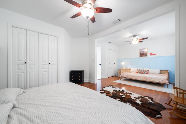 bedroom with ceiling fan and hardwood / wood-style floors