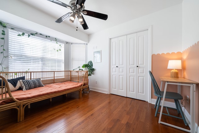 living area featuring ceiling fan and hardwood / wood-style floors