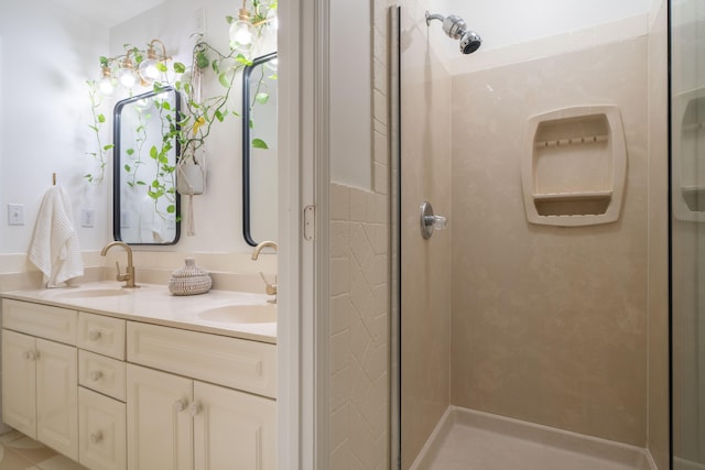 bathroom featuring a shower and vanity