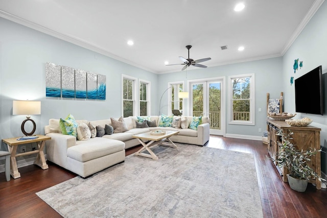 living room featuring ceiling fan, dark hardwood / wood-style flooring, and ornamental molding